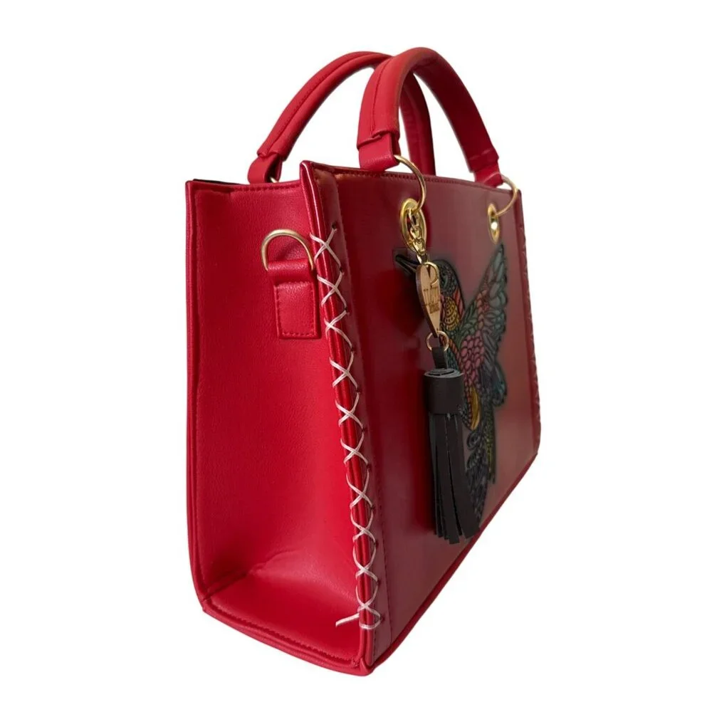 Tooled multicolored hummingbird on a vegan leather red satchel with make up bag